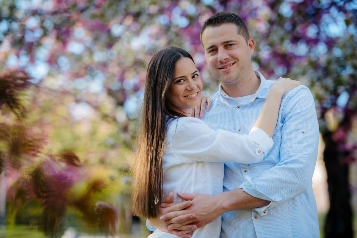 Clear aligner tray being placed on teeth to close a gap between the front teeth