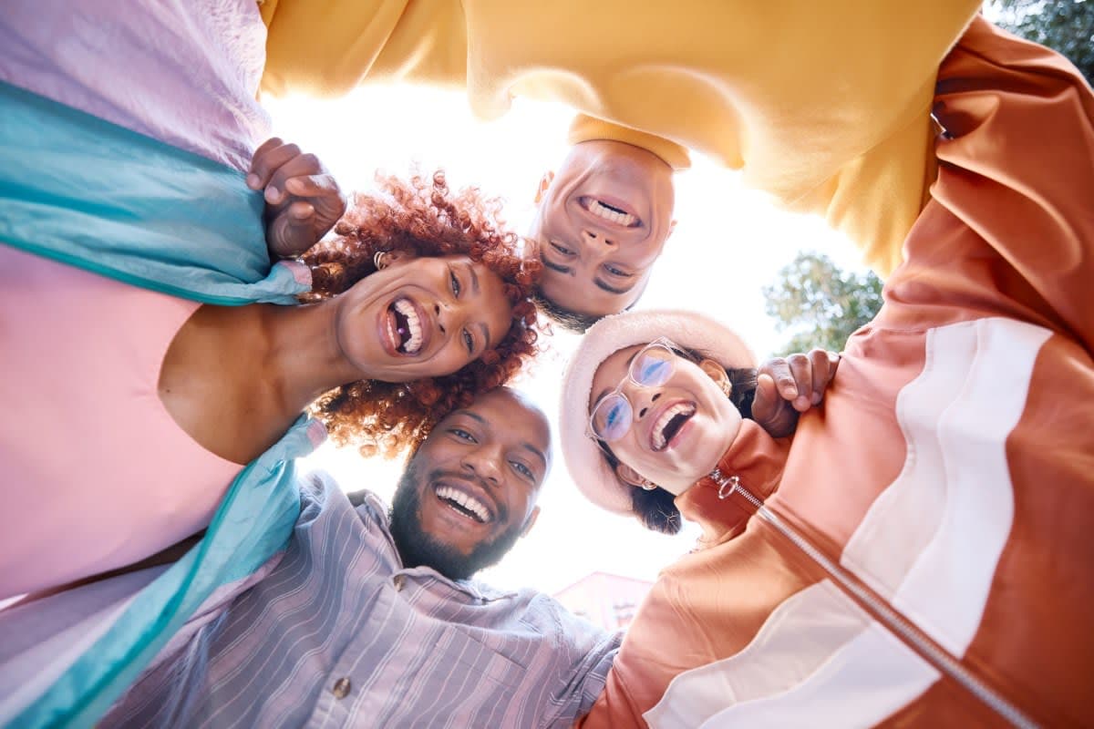 Adult patient smiling during an orthodontic consultation discussing affordable braces options