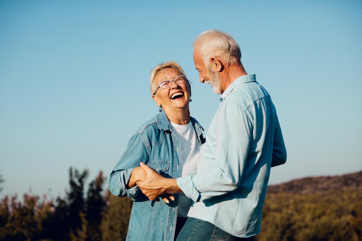 Dental professional examining a patient's implant site where the abutment has become visible