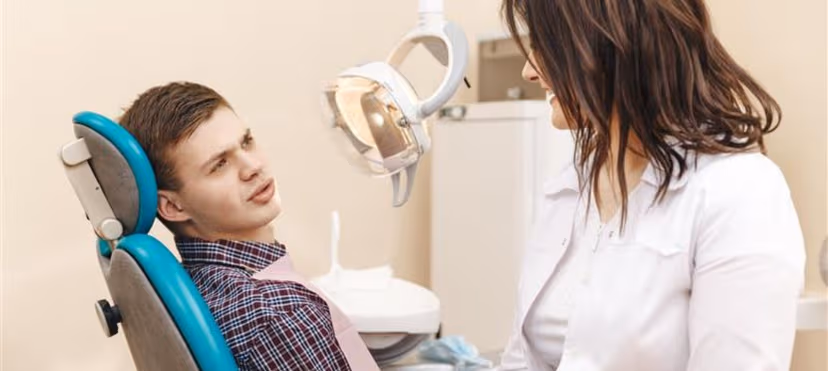 Person smiling confidently illustrating how improving oral health boosts daily quality of life