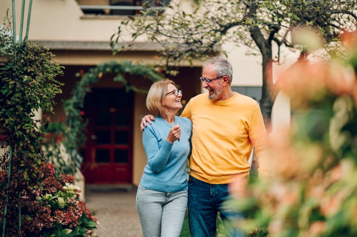 Patient discussing denture financing options with a dental team member