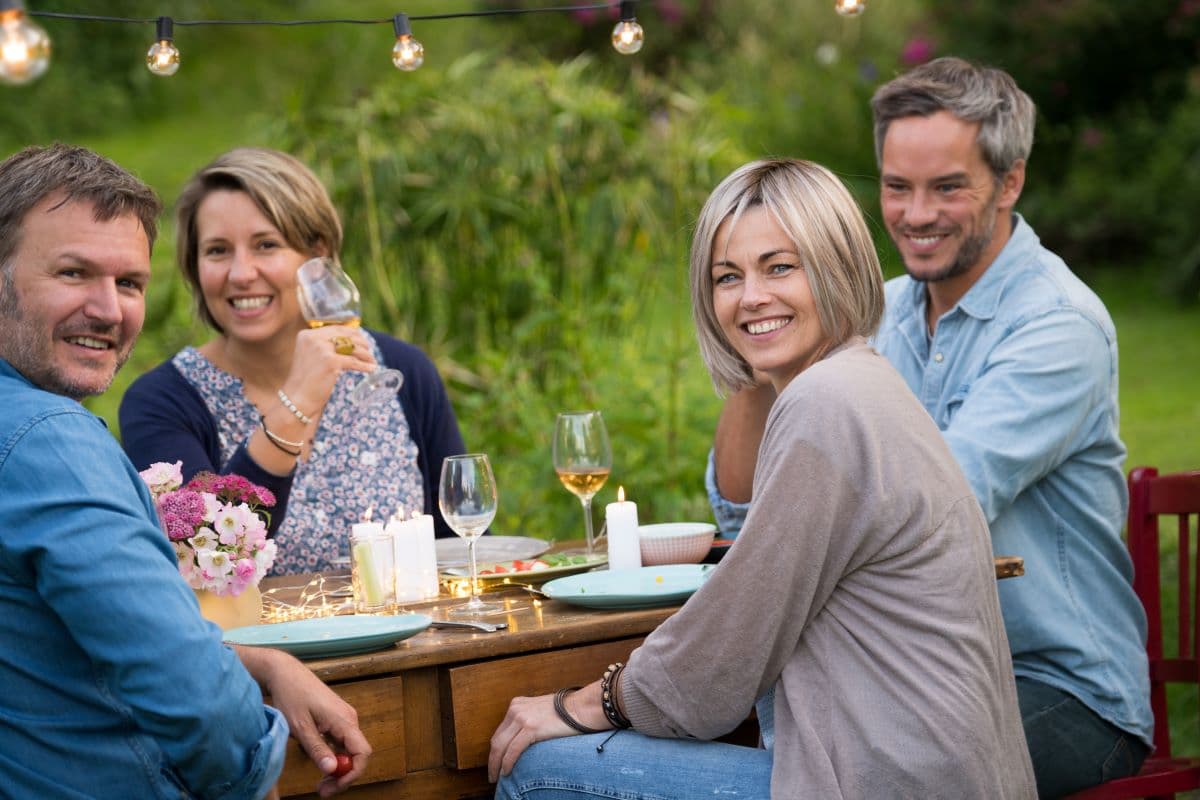 Patient enjoying a meal confidently after restoring bite force with All-on-4 dental implants