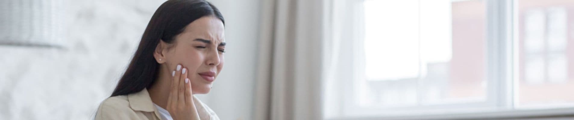 Dentist assessing a fractured tooth during a clinical examination