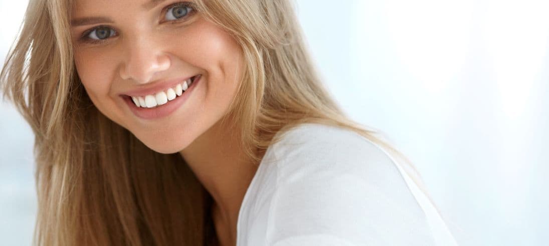 Tired person illustrating how lack of sleep affects oral health and hygiene