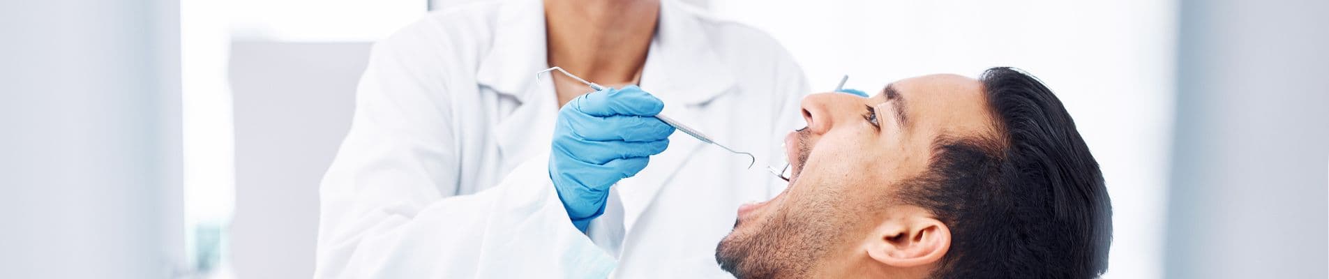 Illustration of a swollen gum with pus associated with a dental abscess requiring professional treatment