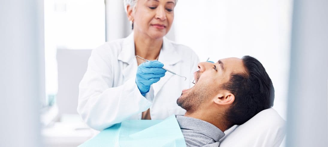 Dental hygienist performing clinical treatment — understanding the scope of restorative work in UK dentistry — Dental Clinic London